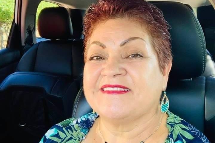 a person sitting on the seat of a car