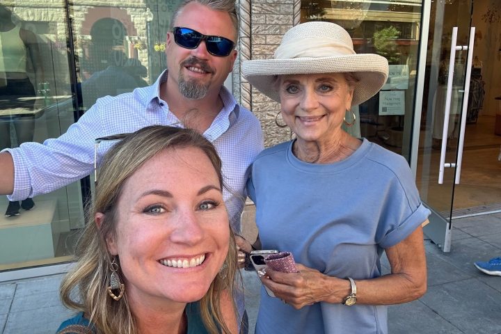 Pleuni Touw wearing a hat talking on a cell phone