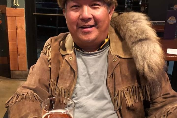 a person sitting at a table in a restaurant