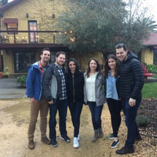 a group of people standing in front of a building