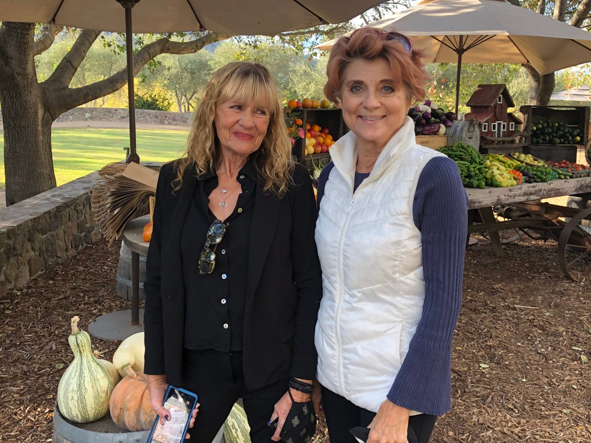 a woman standing in front of a tree posing for the camera